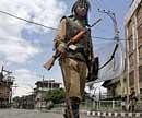 An Indian paramilitary soldier stands guard on a deserted street during a strike in Srinagar, India. AP