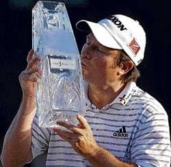 Maiden title: South Africas Tim Clark poses with the Players Championship trophy on Sunday. AFP