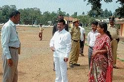 Minister for Sports and Youth Service Goolihatti Shekhar  discussing on work of outdoor  stadium in Madikeri with the  officials.