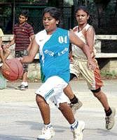 Speedy: Beagles Likita (left) moves past Pawana of Appaiah BC during their State Youth championship match. DH photo