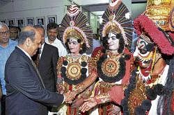 Chief Election Commissioner Navin Chawla greeting Yakshagana artistes who performed a short play on the importance of voting and democracy during ECs Diamond Jubilee celebrations in Bangalore on Tuesday. dh photo
