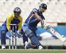 Star performer: Suresh Raina hits a six during his half-century against Sri Lanka in St Lucia on Tuesday. AP