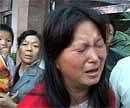 A Chinese woman cries after she discovered her child was among the victims of an attack on a kindergarten in Linchang Village in the Shaanxi province on Wednesday. AFP