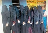 Women waiting in a queue to excercise their franchise at a polling booth in Mangalore on Wednesday.  dh photo