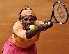 Serena Williams from US returns the ball during her match against Nadia Petrova from Russia at the Madrid Open Tennis Tournament in Madrid, on Wednesday. AP