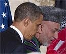 President Barack Obama, left, and Afghan President Hamid Karzai leave a news conference in the East Room of the White House on Wednesday. AP