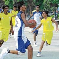 Firm focus:  Farhan of Ulsoor Sports Union is poised to score against VBC Mandya at the State Youth championship. DH photo
