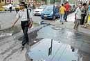 Drinking water flowing for the last three days, due to leakage from a pipe at the junction  of MG Road and Rest House Road. DH Photo