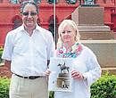 Cubbons great grand-daughter Charlotte Narula and husband Anthony Ajaypal Narula pose in front of Lord Cubbons statue at Cubbon Park in Bangalore on Thursday.  DH photo