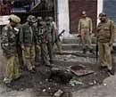 Police inspect the site of a grenade explosion in Srinagar on Friday. AP
