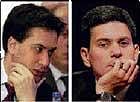 This combination picture shows former energy and climate change secretary Ed Miliband (left) and his brother former foreign secretary David Miliband. AP