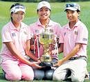 Thailands Pinrath Loomboonruang (left), Pavarisa Yoktuan and Benyapa Niphatsophon (right) pose with the RCGC Trophy in Bangalore on Saturday. DH Photo
