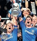Chelseas John Terry (left) and Frank Lampard  celebrate their FA Cup final win on Saturday. Reuters