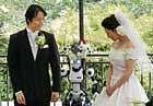 A humanoid robot acts as a witness at the wedding ceremony between Tomohiro Shibata and Satoko Inoue. Reuters