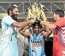 Indian skipper Rajpal Singh (left), Arjun  Halappa and Korean Kim Yong-bae with the trophy. Reuters