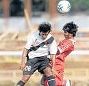 Sibra Narzaary of Vasco (left) and Prasoon R of Malabar United battle for possession during their I-League Second Division match in Bangalore on Sunday. DH Photo