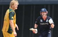 England cricketer Paul Collingwood (R) reacts after scoring the winning shot as Australian cricketer Shane Watson looks on during the Men's ICC World Twenty20 final match between Australia and England at the Kensington Oval Cricket Ground in Bridgetown on Sunday. AFP