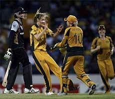 Australia's Ellyse Perry, second left, celebrates after taking a wicket during their Twenty20 Cricket World Cup women final match against New Zealand  in Bridgetown, Barbados on Sunday. AP