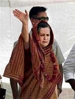 Congress President Sonia Gandhi waves to party workers during a meeting at  Saraini in her constituency Raebareli on Monday. PTI