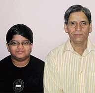 Proud: Vivek with his father.