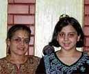 Triumphant: Poorna with mother Shraddha Kumar.