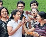Students celebrate their CBSE Class XII results at National Public school, Rajaji Nagar in Bangalore on Wednesday. DH Photo by Kishor Kumar Bolar
