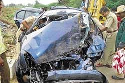 Police inspecting the mangled car involved in an accident near Anesidri village, Hiriyur taluk on Thursday. dh photo
