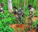 Security personnel checking a forest area a day after Maoists blew up a CRPF vehicle killing five persons near Lalgarh in West Midnapore district of West Bengal on Thursday. PTI