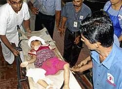 A surviving child is taken to a hospital after the plane crash in Mangalore. Reuters