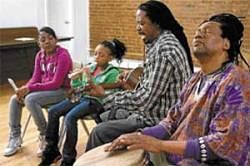 Revival: James Lovell (second from right) leads a small Garifuna class at the Biko Transformation Centre in New York. Photo by Katherine Glicksburg/NYT
