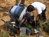 Forensic experts number the boxes recovered from the remains of the Air India Express plane that crashed in Mangalore, on Sunday.