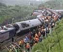 Rescuers work at the site where a passenger train derailed in east China's Jiangxi Province on  Sunday.  AP Photo/Xinhua