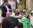 A woman paying her respect to the Gorkha leader Madan Tamang, in Darjeeling on Saturday. PTI Photo