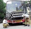 File photo of traffic cops inspecting a BMTC bus after an accident.