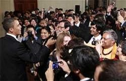 President Barack Obama greets audience members as he hosts a reception to celebrate Asian American and Pacific Islander Heritage Month in the East Room of the White House in Washington on Monday. AP Photo