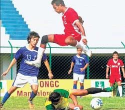 TIMELY TACKLE: NISA goalkeeper L Prem Kumar Singh (on the ground) thwarts Tarif Ahmed of ONGC in the I-League Second Division match on Tuesday. DH PHOTO