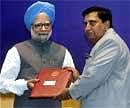 Prime Minister Manmohan Singh presents the Lifetime Achivement award 2009 to Dr. Sudarshan Kumar Salwan during DRDO awards function in New Delhi on Wednesday. PTI