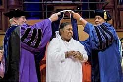 Mata Amritanandamayi Devi is conferred with the the honorary degree of doctorate in Humane Letters by State University of New York (SUNY) at a special convocation in New York on Tuesday. PTI Photo