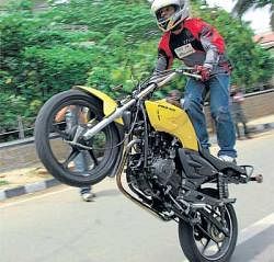 DAREDEVILRY: Team TVS Racing rider Rafiq shows his skills during a demonstration in Bangalore on Wednesday. DH PHOTO