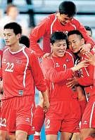 Red brigade: North Koreas players celebrate after holding Greece to a 2-2 draw in a friendly on Tuesday. AP
