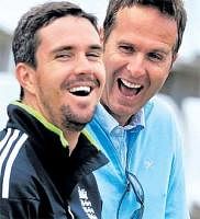 Having a ball! Kevin Pietersen and former England skipper Michael Vaughan share a joke at Lords on Wednesday. AP
