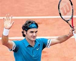 Job well done: Roger Federer celebrates after his second-round win over Alejandro Falla at the French Open. AP