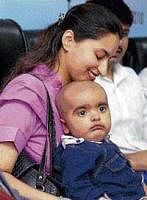 Shaheer Imran, the one-year-old Pakistani boy who underwent an unrelated stem cell transplant, with his mother at a press conference in New Delhi on Tuesday. PTI