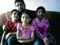 Nasir Dawoodi along with his three children.