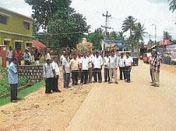 MLA D N Jeevraj inspecting the proposed land for laying footpath from bus stand to Town Panchayat Circle in N R Pura.