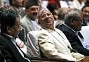 Nepal's Prime Minister Madhav Kumar Nepal(C) and Pushpa Kamal Dahal(L) attend a session at Nepal's Constitutional Assembly in Katmandu on Saturday.AP