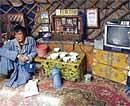 Sorry Tale: Munkhbat Lkhagvasuren, a herder, in his yurt in Uvurkhanhai, Mongolia. (Gilles Sabrie/The New York Times)