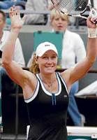 Australias Samantha Stosur is jubilant after ousting former French Open  champion Justine Henin on Monday. Stosur won 2-6, 6-1, 6-4.  Reuters