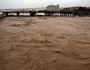 Torrents of water sweep through the Omani capital Muscat following heavy rains as Cyclone Phet passed over the Gulf Sultanate on Friday. AFP