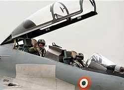 SU-30 pilots wave before departure from Bareilly on Monday for Exercise Garuda, scheduled in France from 14-25 June. PTI